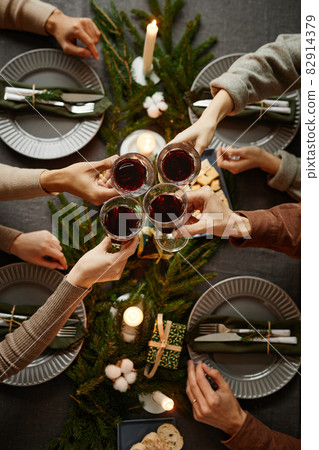 Friends Enjoying Christmas Dinner Top View 82914379