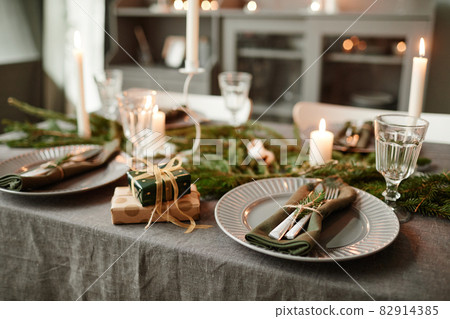 Elegant Dining Table on Christmas with Candles Elegant Dining Table on Christmas with Candles 82914385
