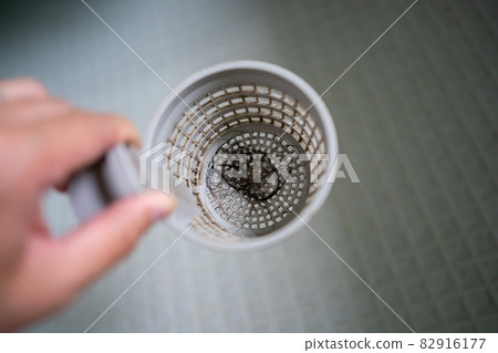Hair at the drain of the bath Hair at the drain of the bath 82916177