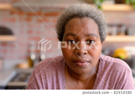 Portrait of serious african american senior woman it kitchen Portrait of serious african american senior woman it kitchen 82918380