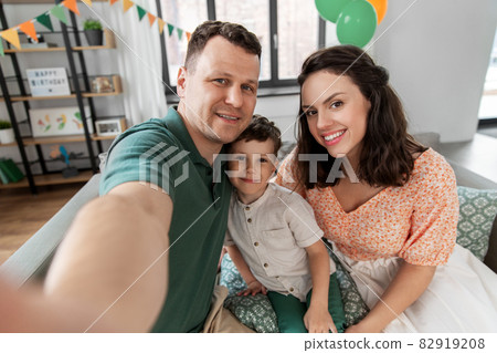 happy family taking selfie on birthday at home happy family taking selfie on birthday at home 82919208