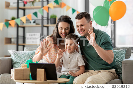 family with tablet pc has video call on birthday family with tablet pc has video call on birthday 82919213