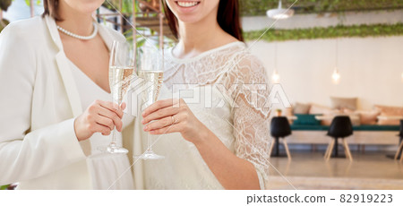 close up of female gay couple with champagne close up of female gay couple with champagne 82919223