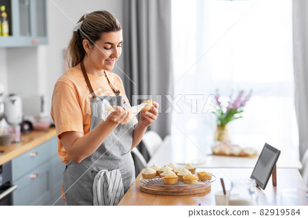woman cooking food and baking on kitchen at home woman cooking food and baking on kitchen at home 82919584