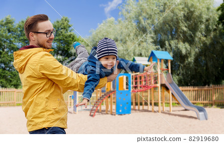 father with son playing and having fun outdoors father with son playing and having fun outdoors 82919680