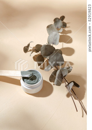 cosmetic clay mask in jar with wooden spatula 82919823