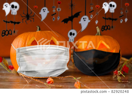 carved pumpkins or jack-o-lanterns in masks carved pumpkins or jack-o-lanterns in masks 82920248
