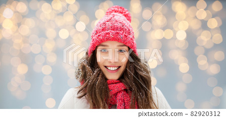 smiling teenage girl outdoors in winter 82920312