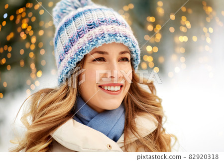 portrait of happy smiling woman outdoors in winter portrait of happy smiling woman outdoors in winter 82920318