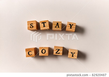 stay cozy words made of wooden toy blocks 82920487