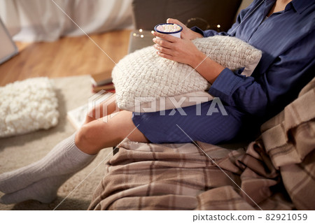 woman drinking hot chocolate at home woman drinking hot chocolate at home 82921059