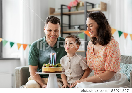 happy family with birthday cake at home 82921207