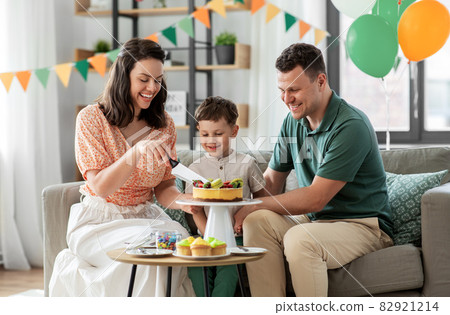 happy family with birthday cake at home happy family with birthday cake at home 82921214