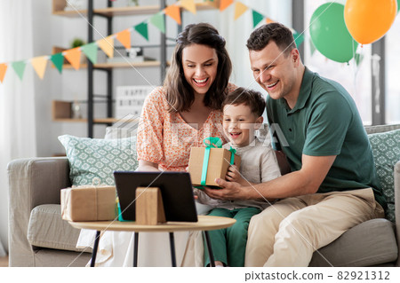 family with tablet pc has video call on birthday family with tablet pc has video call on birthday 82921312
