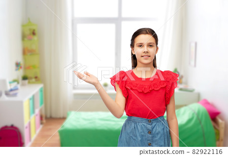 happy smiling girl holding something on her hand 82922116