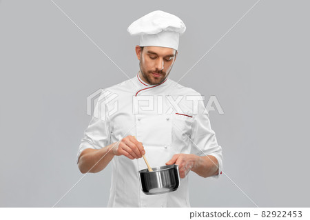 male chef with saucepan cooking food male chef with saucepan cooking food 82922453