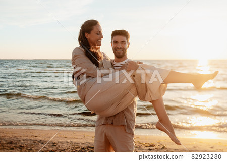 happy couple having fun on summer beach happy couple having fun on summer beach 82923280