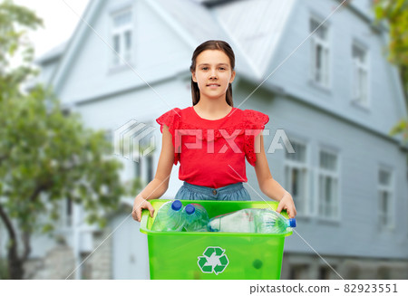 smiling girl sorting plastic waste smiling girl sorting plastic waste 82923551