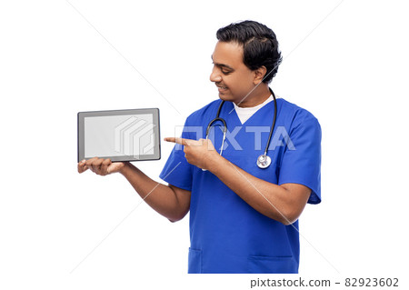 happy doctor or male nurse showing tablet computer happy doctor or male nurse showing tablet computer 82923602
