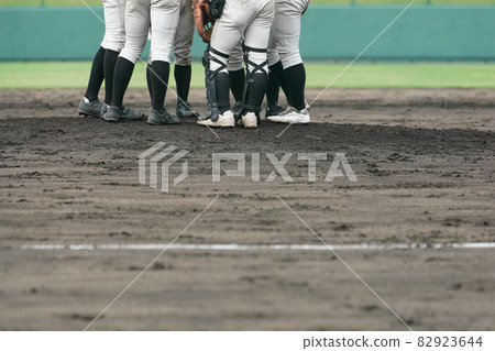 Infielders such as pitchers and catchers gathering on the mound during a baseball game 82923644