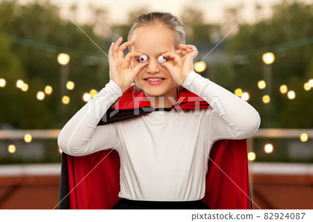 girl in halloween costume of dracula with eyeballs girl in halloween costume of dracula with eyeballs 82924087