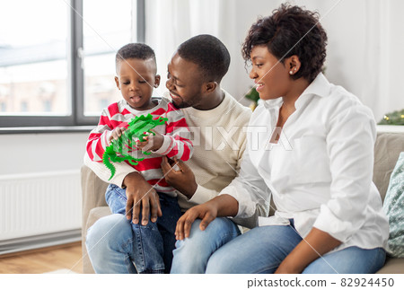african family with toy on christmas at home african family with toy on christmas at home 82924450