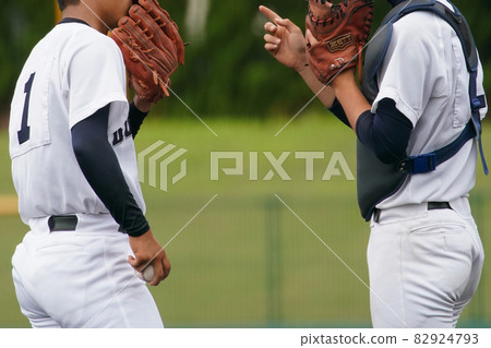 Pitchers and catchers gather on the mound during a baseball game Pitchers and catchers gather on the mound during a baseball game 82924793