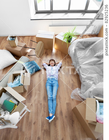 happy woman with boxes moving to new home happy woman with boxes moving to new home 82925236