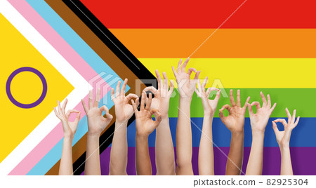 hands showing ok sign over progress pride flag hands showing ok sign over progress pride flag 82925304