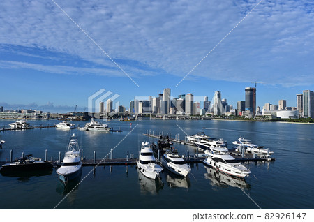 Island Gardens Deep Harbour Marina under summer cloudscape in Miami. 82926147