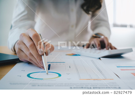 Fund managers researching and analysis Investment stock market by financial paperwork. Fund managers researching and analysis Investment stock market by financial paperwork. 82927479