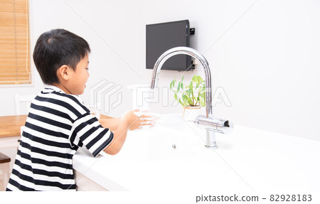 Elementary school boy washing hands Elementary school boy washing hands 82928183