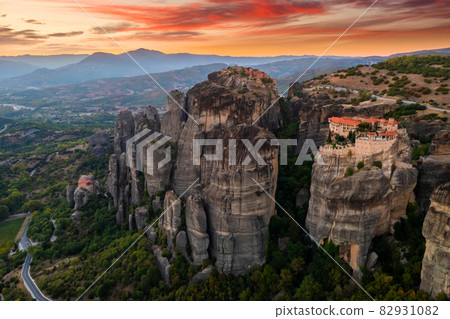 Mountain monastery and rocks in Meteora at sunset. Greece. 82931082