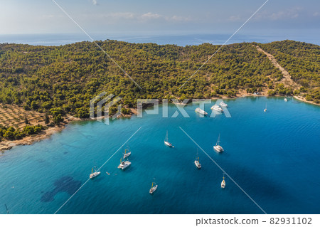 Yacht sailing near the rocky coast in Turkey. Luxury vacation at sea Yacht sailing near the rocky coast in Turkey. Luxury vacation at sea 82931102