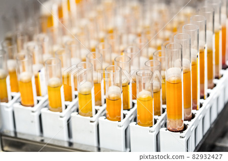 Test-tubes with yellow liquid in the laboratory Test-tubes with yellow liquid in the laboratory 82932427