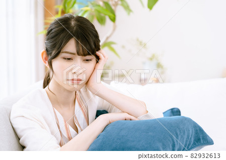 A woman suffering from illness A woman suffering from illness 82932613