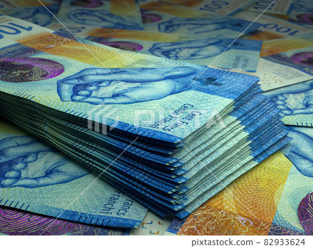 Swiss money. Swiss franc banknotes. 100 CHF francs bills. 82933624