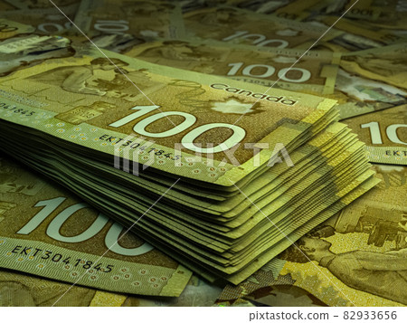 Canadian money. Canadian dollar banknotes. 100 CAD dollars bills. 82933656