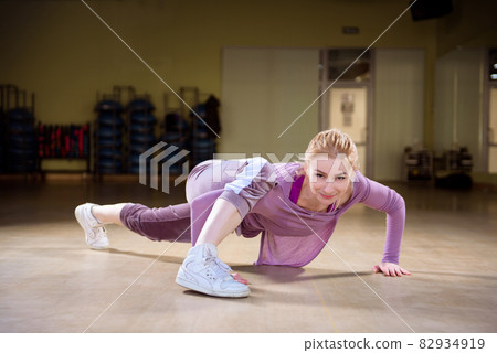 Young sports trainer dancing in the gym. 82934919