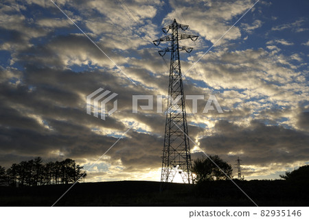 Electricity transmission tower in the evening Electricity transmission tower in the evening 82935146