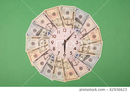 Concept of clock and dollar. Clock on mandala kaleidoscope from money. Abstract money background raster pattern repeat mandala circle. Concept of clock and dollar. Clock on mandala kaleidoscope from money. Abstract money background raster pattern repeat mandala circle. 82936623