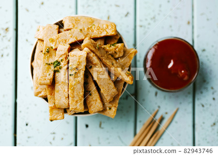 fried mock chicken strips and ketchup 82943746