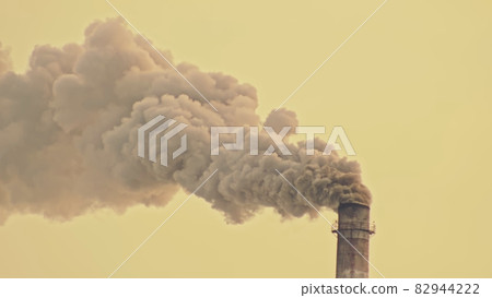 This smoke coming from the chimney in a factory. Harmful emissions into the atmosphere, from the pipe. Serious damage the environment. 82944222