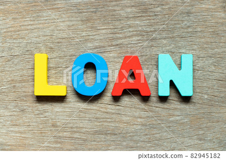 Color alphabet letter in word loan on wood background Color alphabet letter in word loan on wood background 82945182