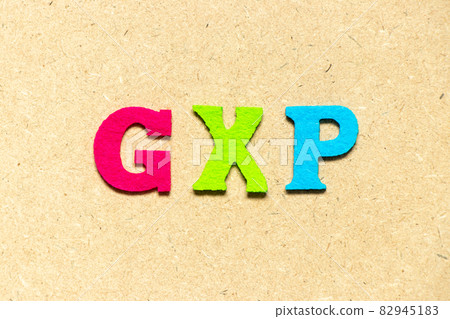 Color cloth alphabet letter in word GXP on wood background Color cloth alphabet letter in word GXP on wood background 82945183