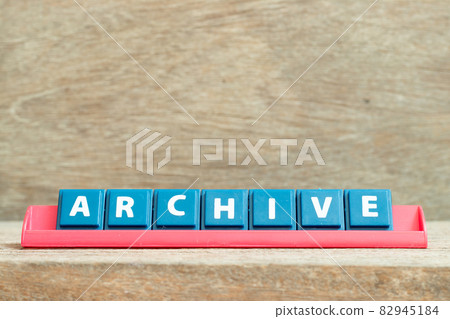 Tile alphabet letter with word archive in red color rack on wood background 82945184