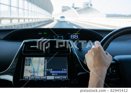 View from the driver's seat of a passenger car traveling on the highway 82945412