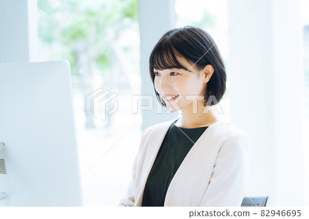 A woman working in a bright office 82946695