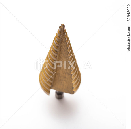 Gold step drill for drilling holes of different diameters, close-up. Professional Gold step drill for drilling holes of different diameters, close-up. Professional 82948030