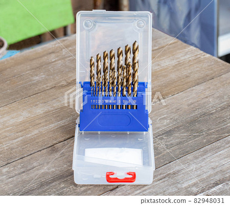 A set of new drills for metal for drilling a hole. Metal tools, industry. Close-up A set of new drills for metal for drilling a hole. Metal tools, industry. Close-up 82948031